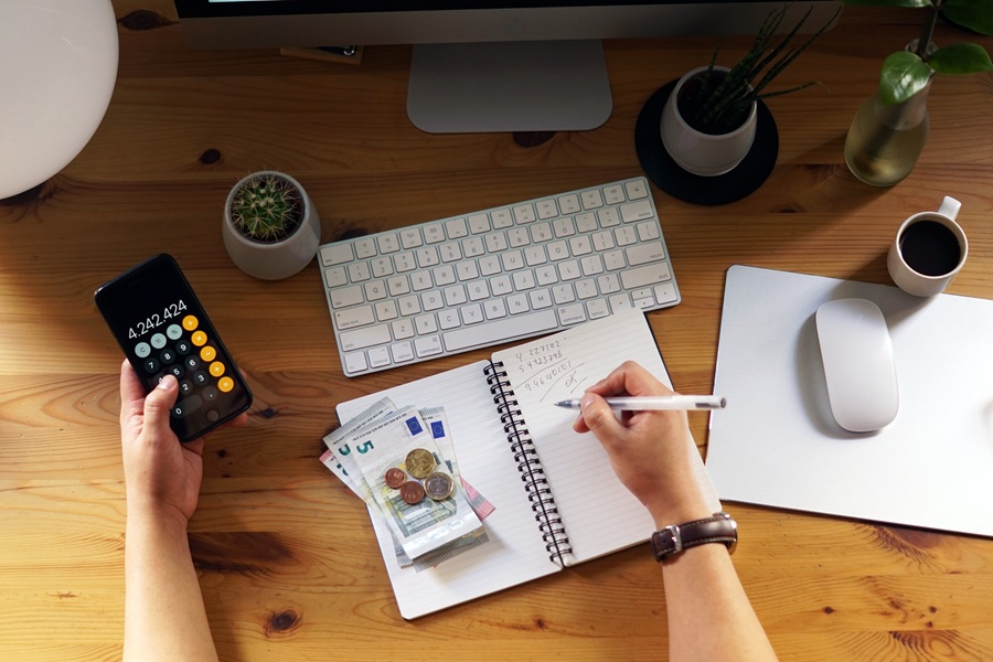 A closeup shot of an entrepreneur working from home on his personal finances and savings